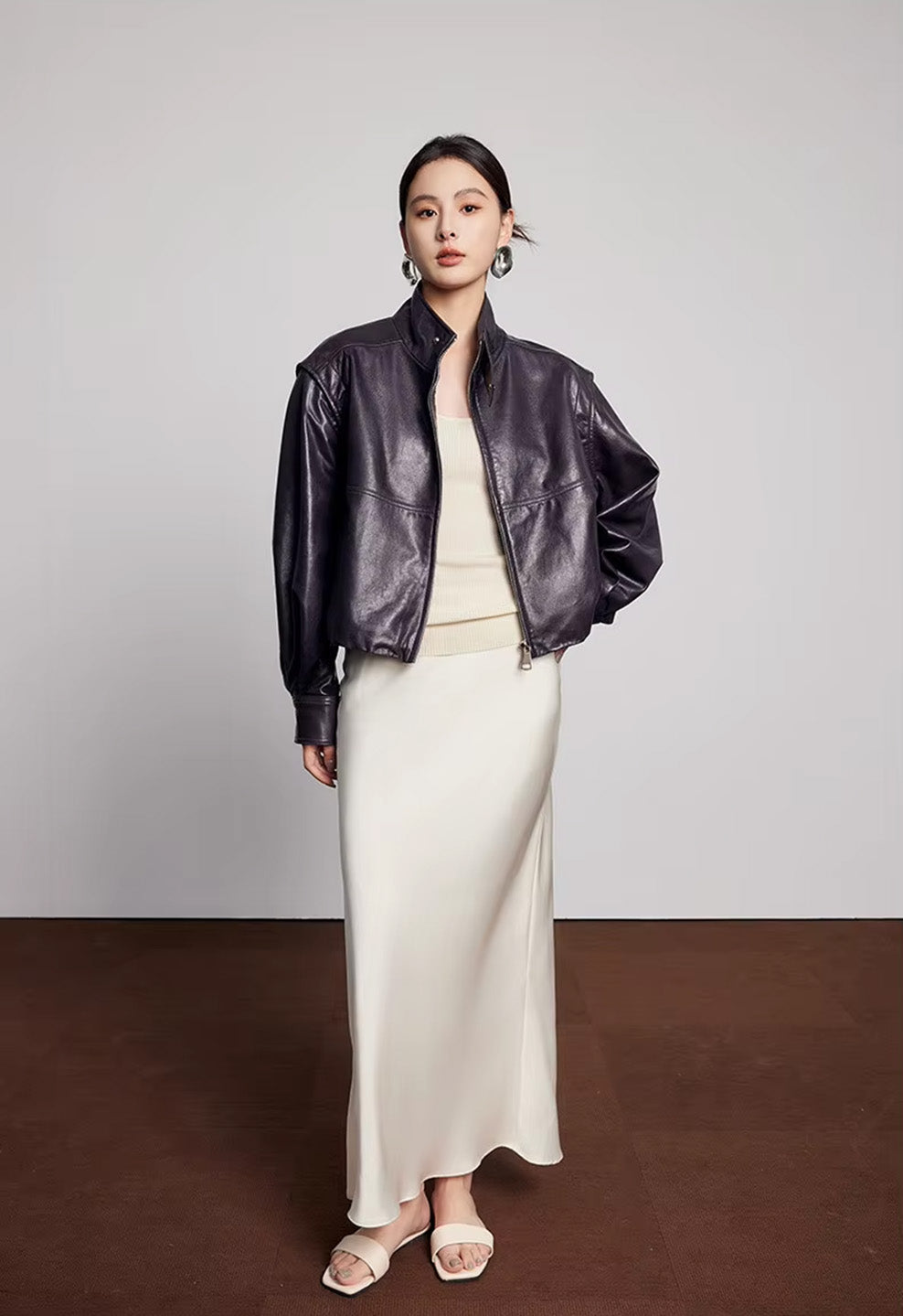 Full-length view of the model wearing the open, unzipped soft-waxed sheepskin jacket — From Borcelleclothes.