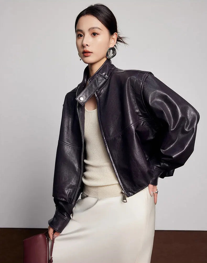 Three-quarter shot of the unzipped sheepskin jacket styled with hand on hip — From Borcelleclothes.