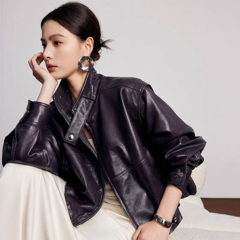 Women's waxed full-grain sheepskin jacket in Without Label. Features a domed silhouette, deep-cut armscyes, and detachable batwing sleeves converting into a vest. — From Borcelleclothes.