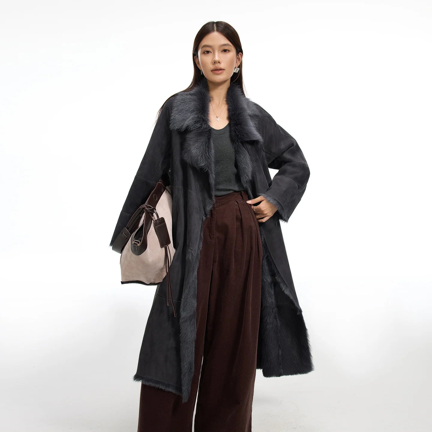 Women's double-breasted goatskin coat with a fluid wrap design, notch lapels, and exposed fur edges. Available in Enigma color. — From Borcelleclothes.