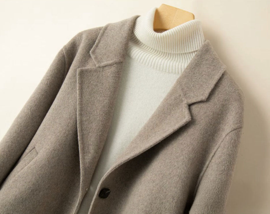 Upper part of the Women’s Double-Sided Australian Wool Jacket in Almond Frost, featuring the tailored notch lapels and clean single-breasted design. From Borcelleclothes.