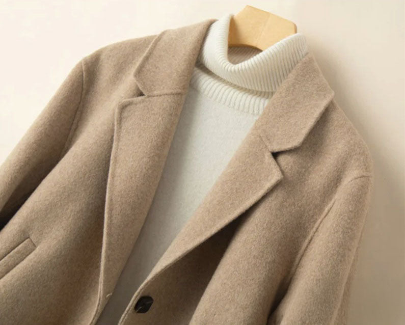 Upper part of the Women’s Double-Sided Australian Wool Jacket in Vanilla, featuring notch lapels and a single-breasted design with elegant detailing. From Borcelleclothes.