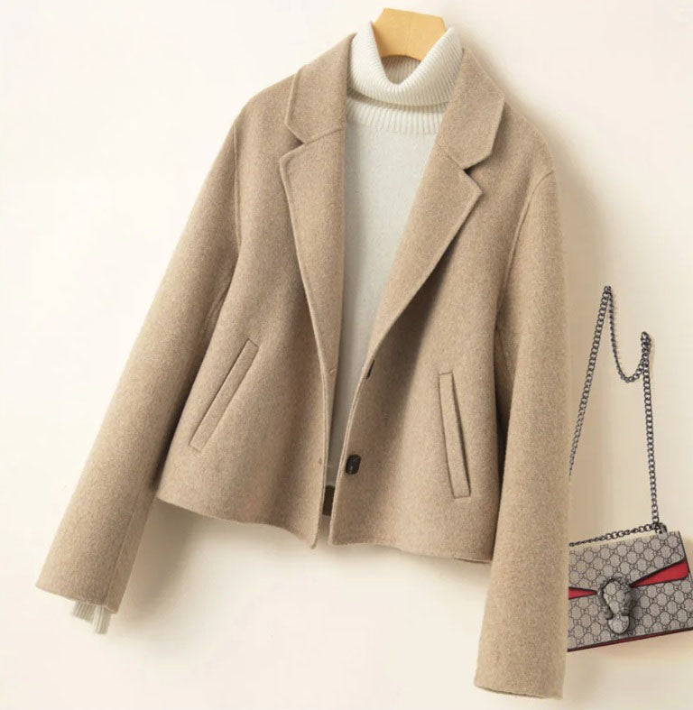 Women’s Double-Sided Australian Wool Jacket in Vanilla, featuring a tailored silhouette, notch lapels, and a single-breasted design with two buttons. Crafted from 100% Australian wool, this jacket combines timeless elegance with sustainable luxury. From Borcelleclothes.