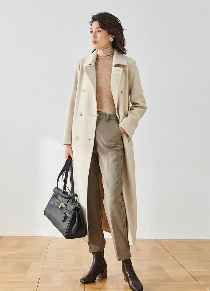 Moment of Promise beige wool cashmere coat, model holding an oversized bag — From Borcelleclothes.