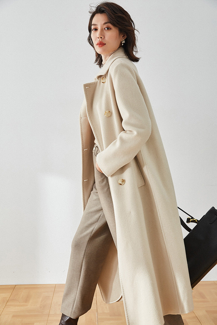 Moment of Promise coat in motion, side view of the double-sided wool blend — From Borcelleclothes.