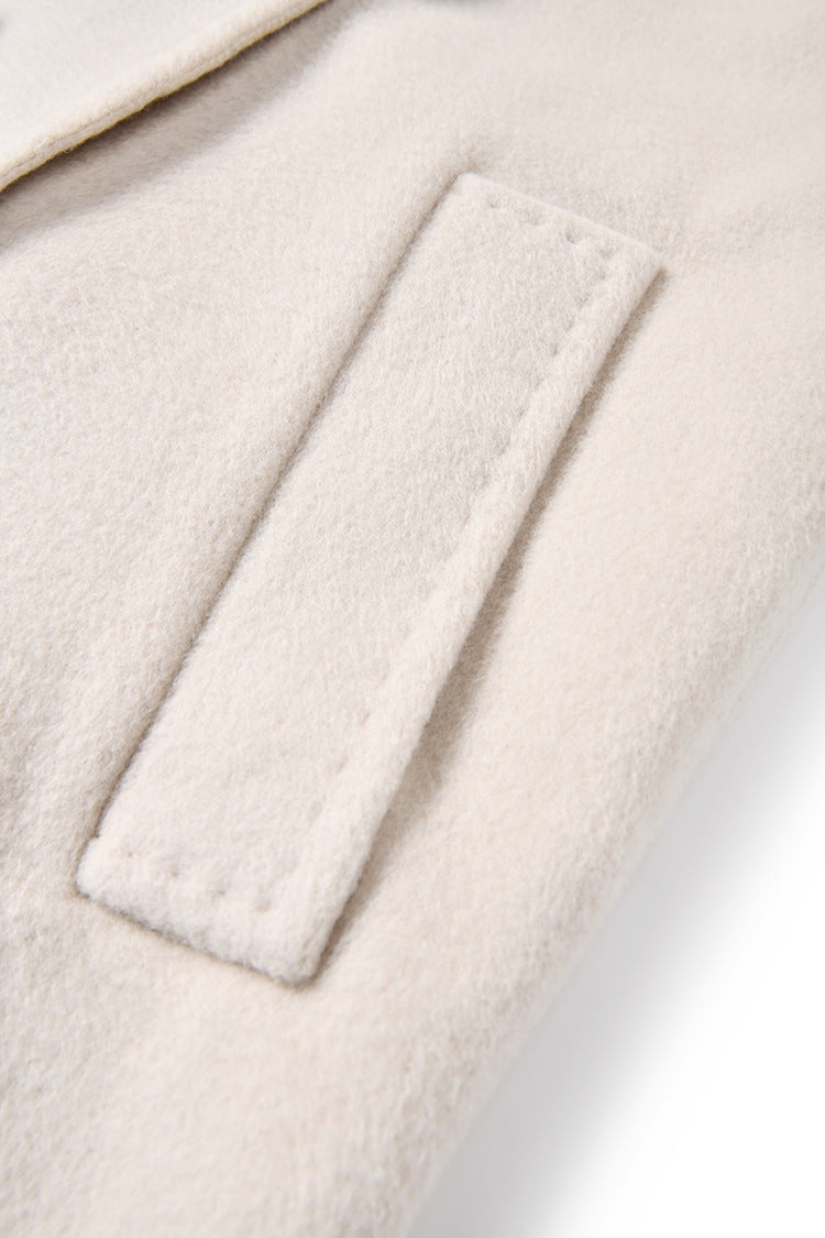 Close-up of the diagonally exposed single-welt side pocket, Moment of Promise — From Borcelleclothes.
