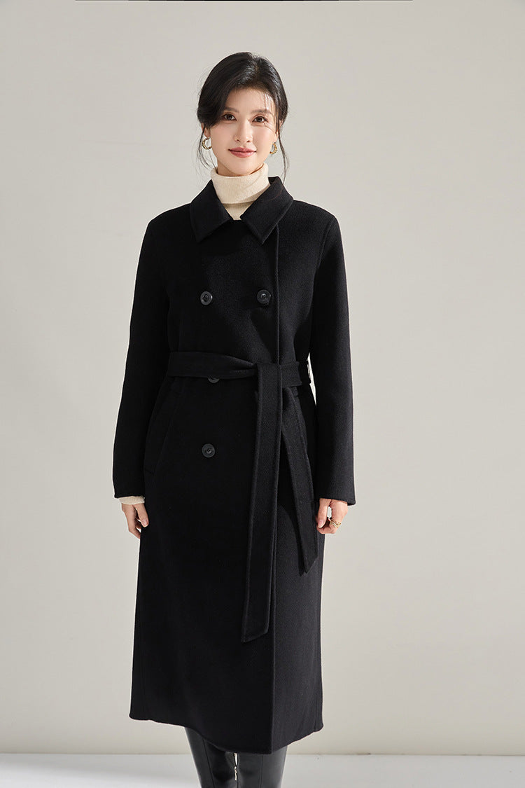 Shadow of a Word black coat, smiling model standing straight in a double-breasted silhouette — From Borcelleclothes.