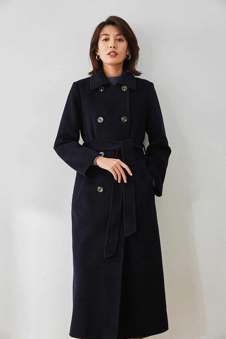Written in Ink wool cashmere coat, model with hand in the coat pocket — From Borcelleclothes.