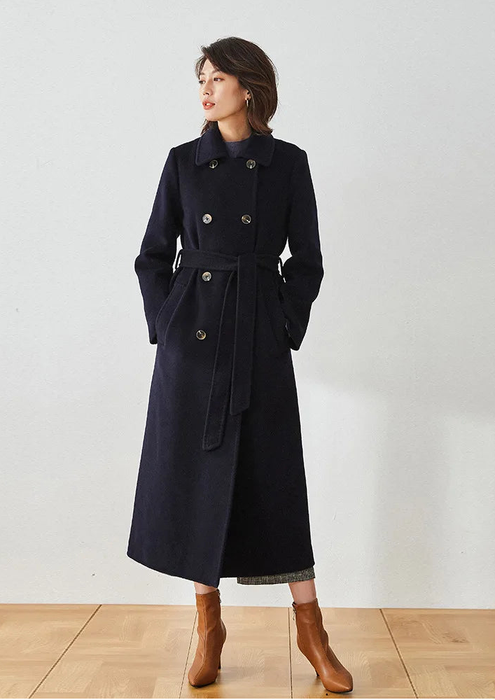 Written in Ink coat, model with both hands in pockets showing the 8-button front — From Borcelleclothes.