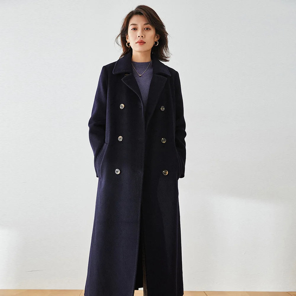 Women's double-sided coat made of Australian wool and cashmere, featuring a pointed collar, eight-button double-breasted closure, and a defined belted waist. Color: Written in Ink. — From Borcelleclothes.