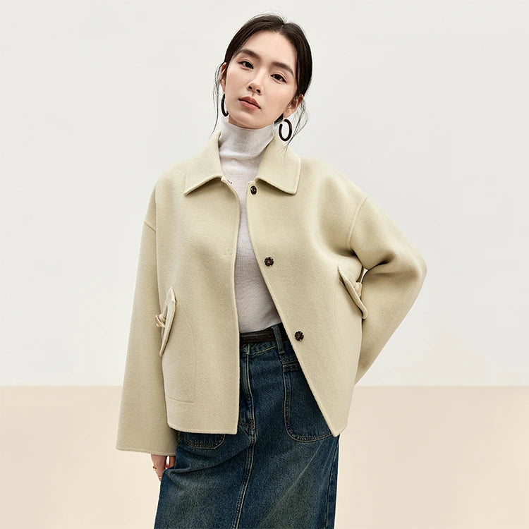 Women's hand-finished double-sided wool jacket in Edelweiss Pollen, with decorative bone toggles and wool tassels. — From Borcelleclothes.