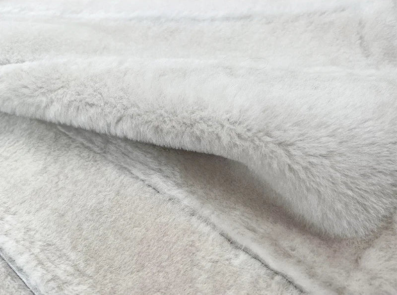 Close view of the white fleece of the Drambuie Cocktail shearling coat — From Borcelleclothes.