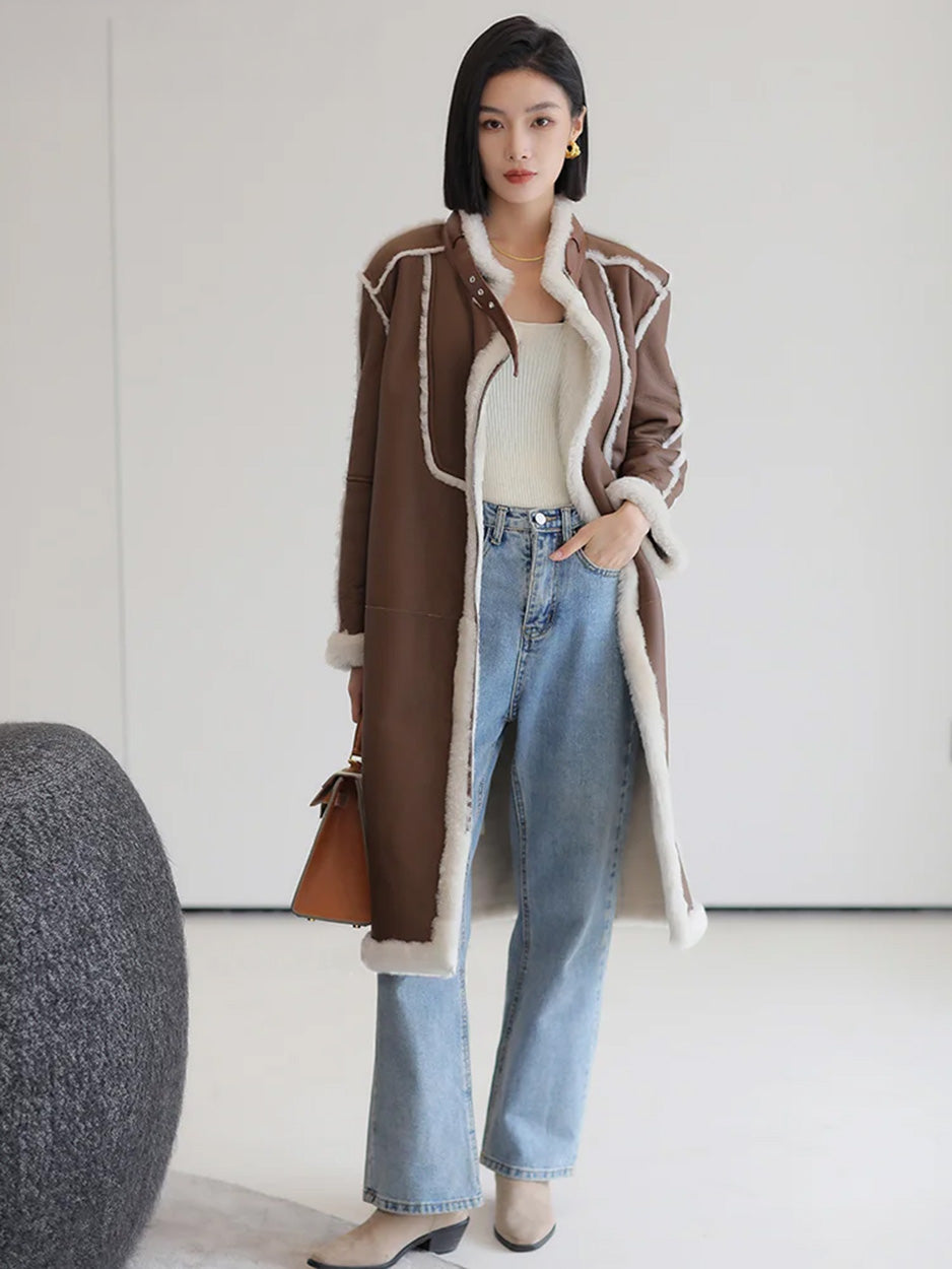 Unzipped Drambuie Cocktail shearling coat, model with one hand in her jeans pocket — From Borcelleclothes.