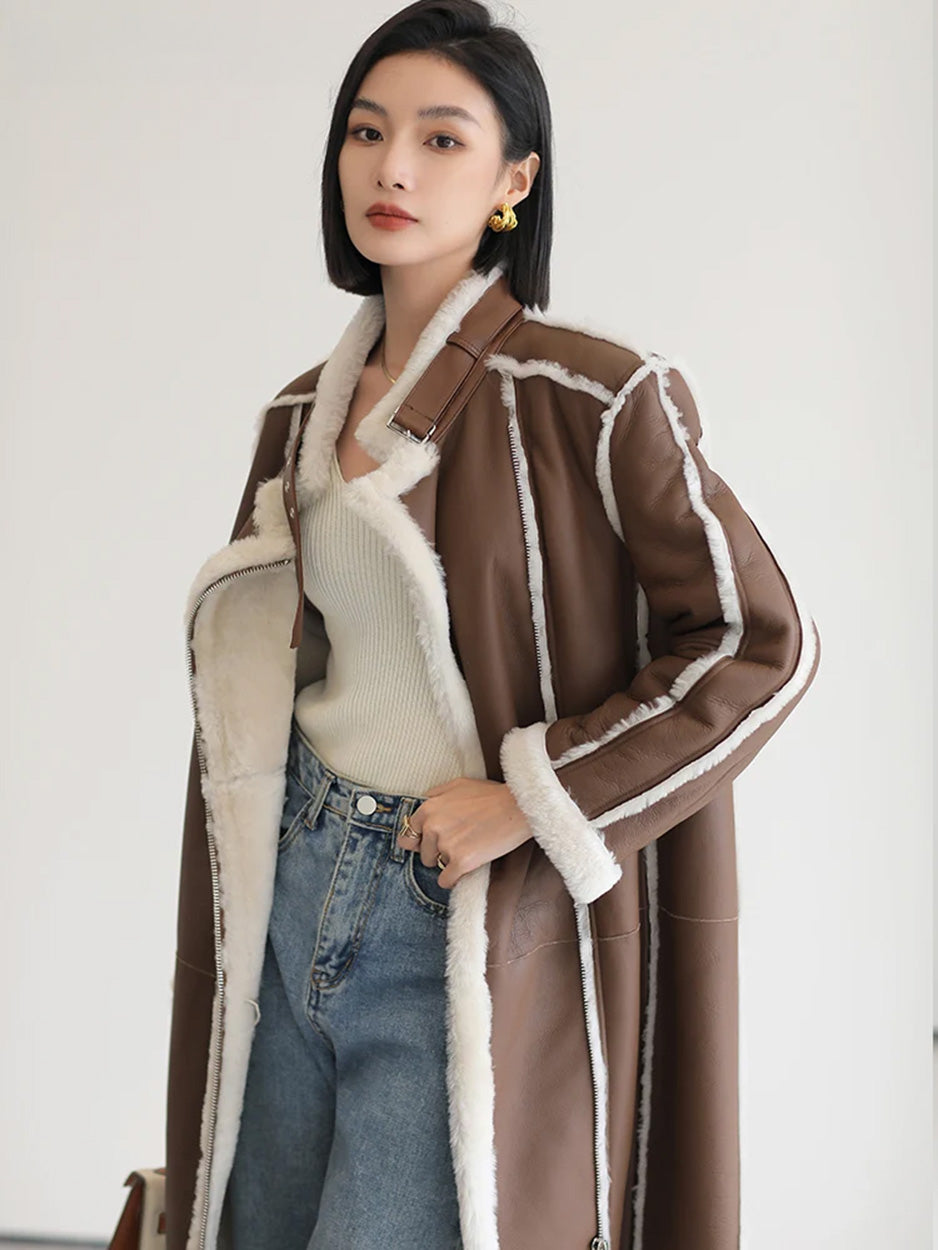 Unzipped Drambuie Cocktail shearling coat, model touching the waistband of her jeans — From Borcelleclothes.