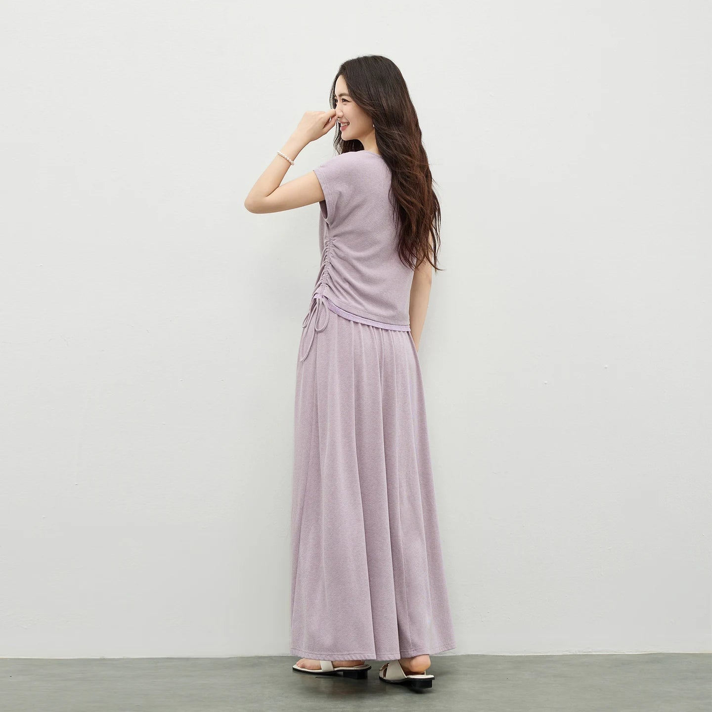 The elegant back view of the Gentle Dream set, focusing on the dropped shoulder line. — From Borcelleclothes.