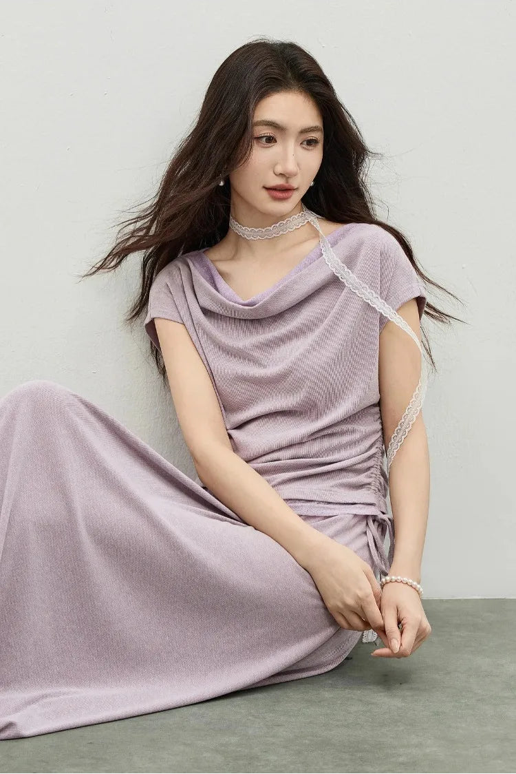 A woman sitting gracefully on the floor in a Gentle Dream rib-knit set, embodying soft movement and ease. — From Borcelleclothes.