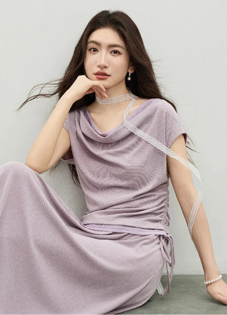 A thoughtful moment of elegance: model resting her chin on her hand, highlighting the voluminous collar. — From Borcelleclothes.