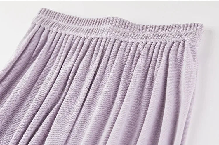 Focus on the comfortable elasticated waistband and the flowing start of the flared skirt. — From Borcelleclothes.