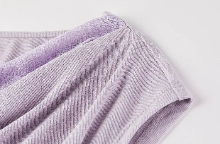 Close-up of the dropped shoulder and refined knit finishing of the sleeveless top. — From Borcelleclothes.