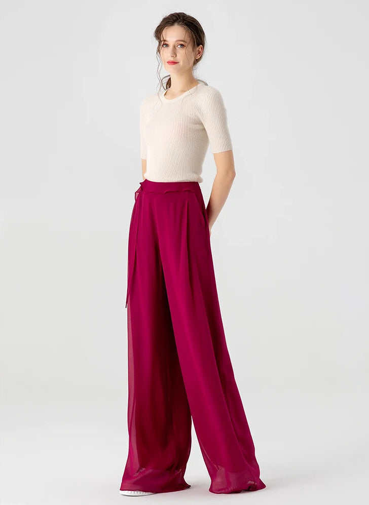 Full-height front view of high-waisted Mulberry silk trousers in Raspberry Perspective featuring a free-falling vertical panel — From Borcelleclothes.