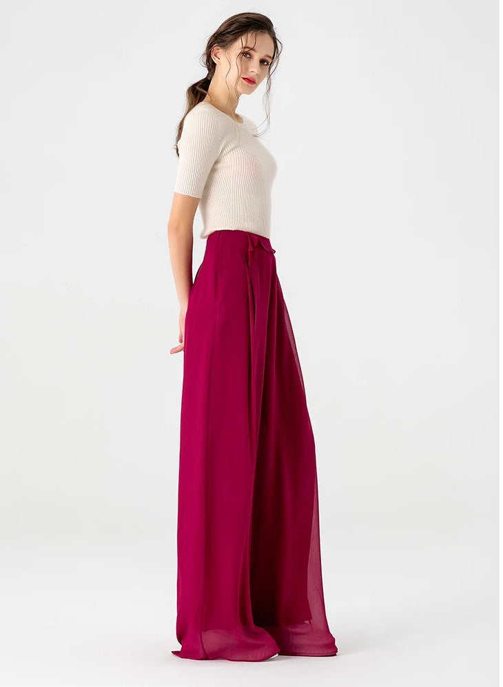 Side full-length view of wide-leg Mulberry silk trousers in Raspberry Perspective highlighting the side zipper and flowing silhouette — From Borcelleclothes.