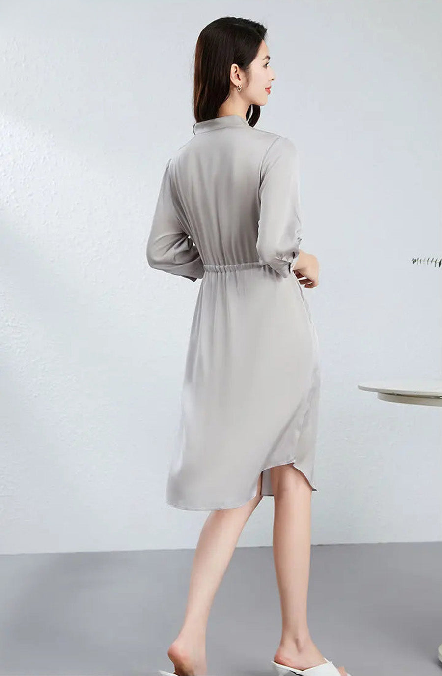 The back silhouette of a woman in the Behind the Clouds edition, highlighting the soft volume created by the waist casing. — From Borcelleclothes.