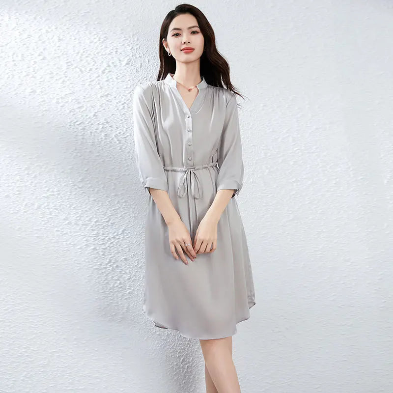 Double georgette silk dress in Behind the Clouds color, with a curved high-low hem, stand-up collar, and drawstring waist creating fluid drapes. — From Borcelleclothes.