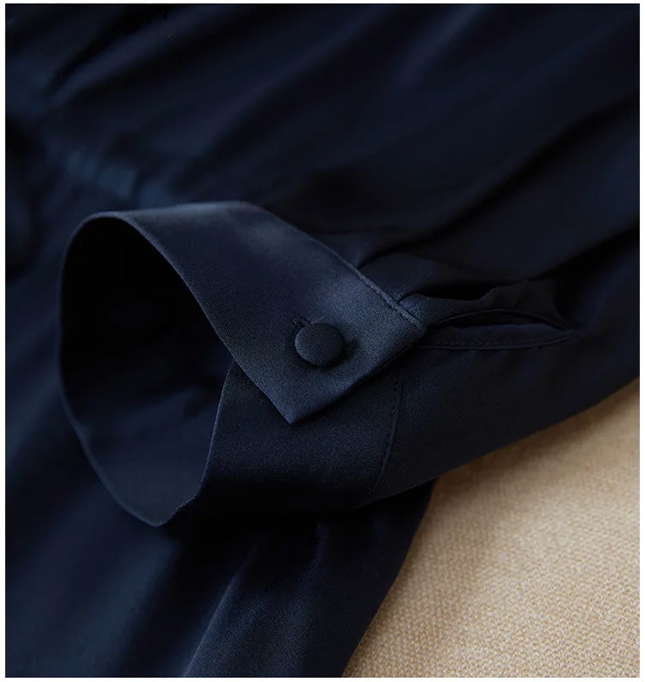 Close-up of the 3/4 set-in sleeve featuring the slit detail and the elegant silk-covered button cuff. — From Borcelleclothes.