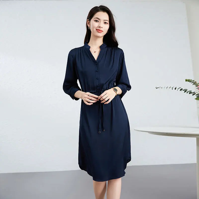 Double georgette silk dress in Monticola Solitarius color, with a curved high-low hem, stand-up collar, and drawstring waist creating fluid drapes. — From Borcelleclothes.
