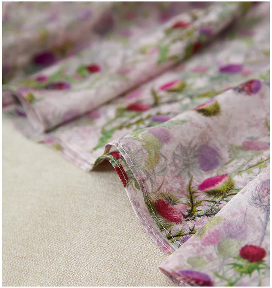 The clean, airy finish of the midi-length hemline in silk crepe de chine, moving with the quiet confidence of a thistle in the wind. — From Borcelleclothes.