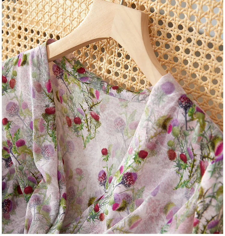 A close-up of the set-in shoulder and gathered sleeve head, illustrating the sophisticated engineering hidden within the soft silk. — From Borcelleclothes.