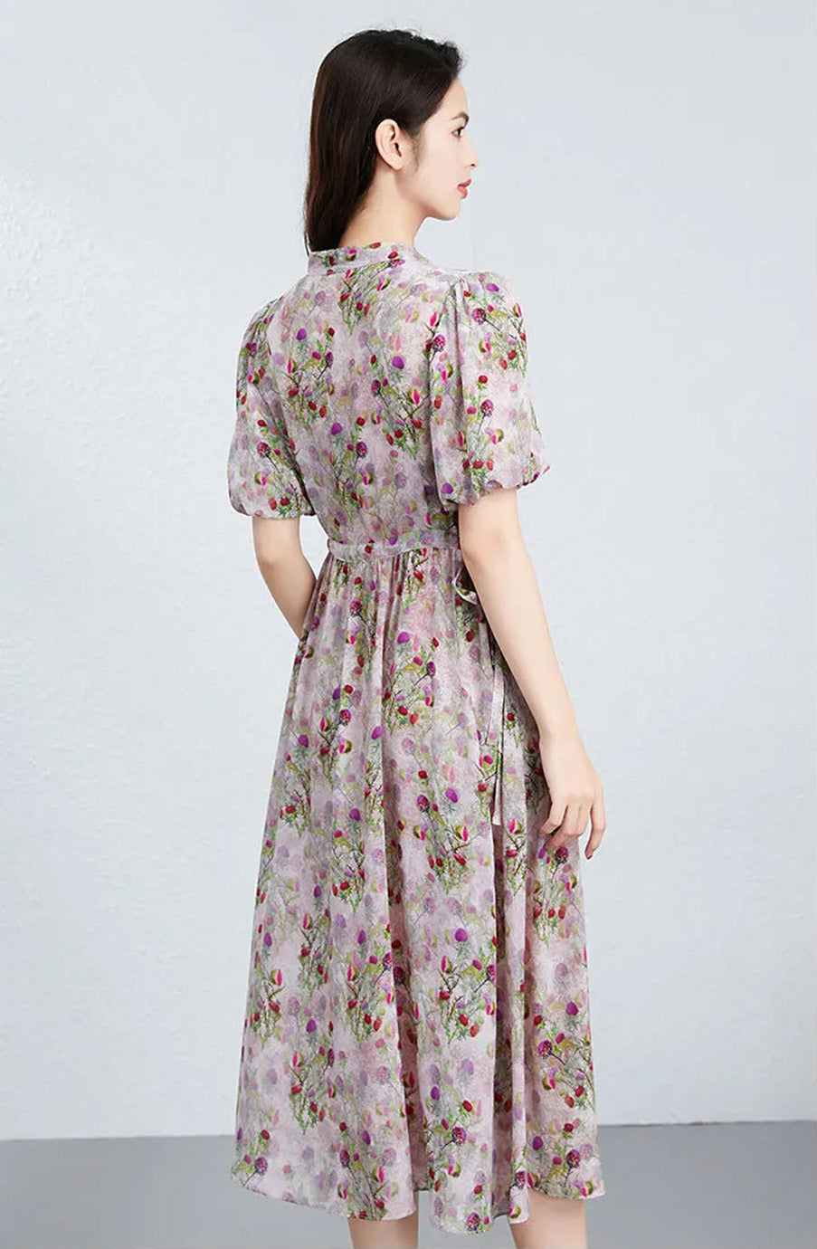 The back view of the silk midi dress, showcasing the seamless fall of the high-quality crepe de chine and its quiet, noble presence. — From Borcelleclothes.
