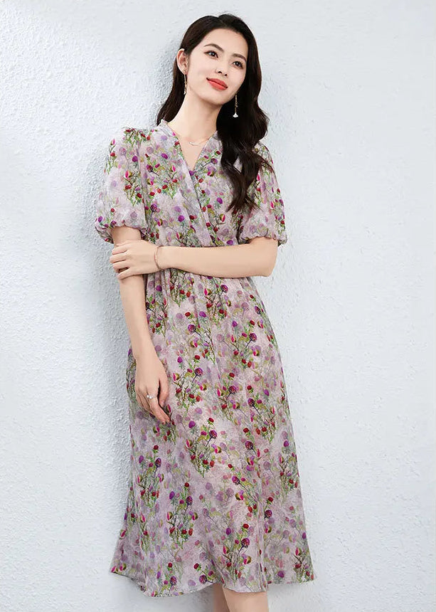 A woman gently resting her hand on her forearm, feeling the matte texture of the silk crepe de chine; a gesture of quiet confidence that highlights the intimate draping of the Thistle Grace dress. — From Borcelleclothes.