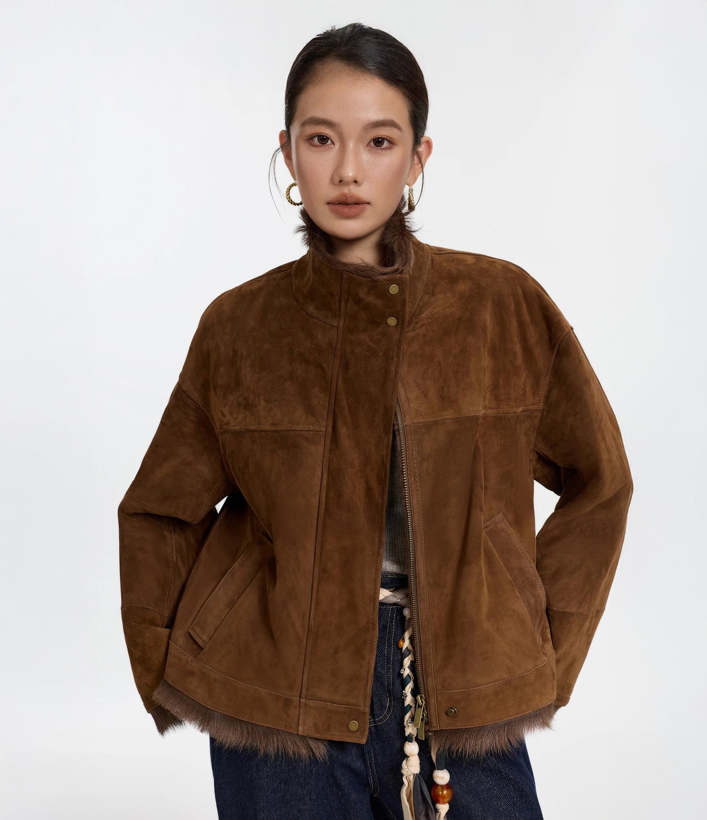 Model in Toscana goatskin jacket, Dark Rum color, standing with hands behind back — From Borcelleclothes.