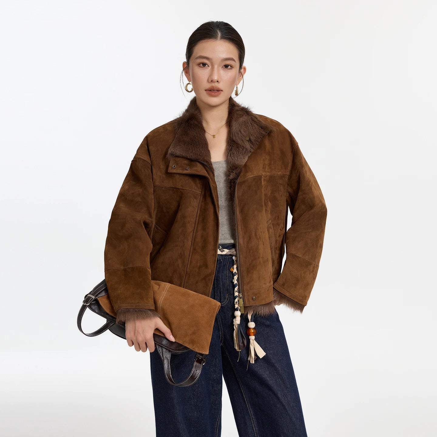 Women's dropped-shoulder Goatskin jacket in Dark Rum, with exposed fur trims, suede finish, and turn-back cuffs. — From Borcelleclothes.