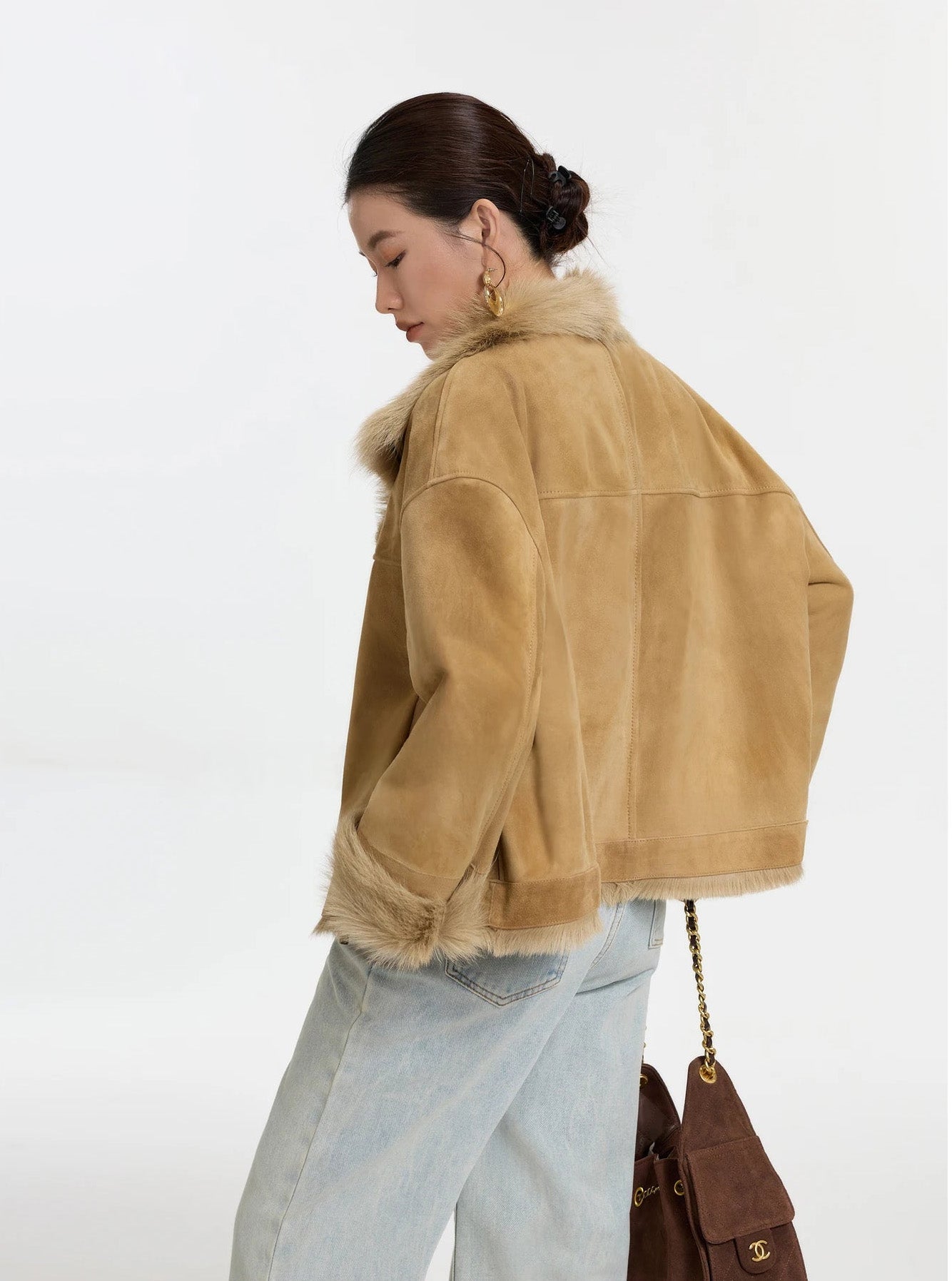 Back view of dropped-shoulder goatskin jacket in Late Wheat, soft silhouette and hem band visible — From Borcelleclothes.