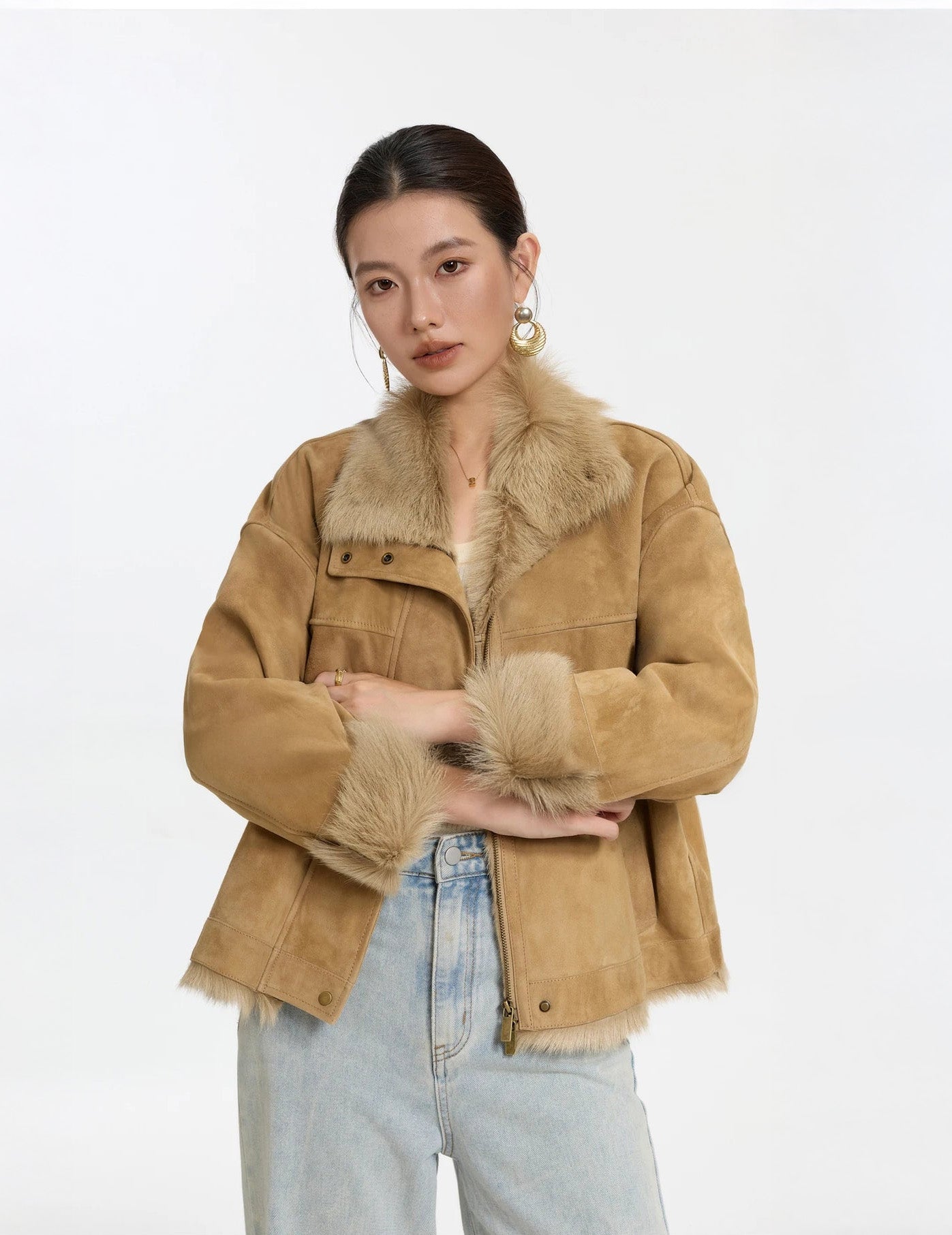 Model in Late Wheat jacket, arms bent above waist, highlighting dropped shoulders — From Borcelleclothes.