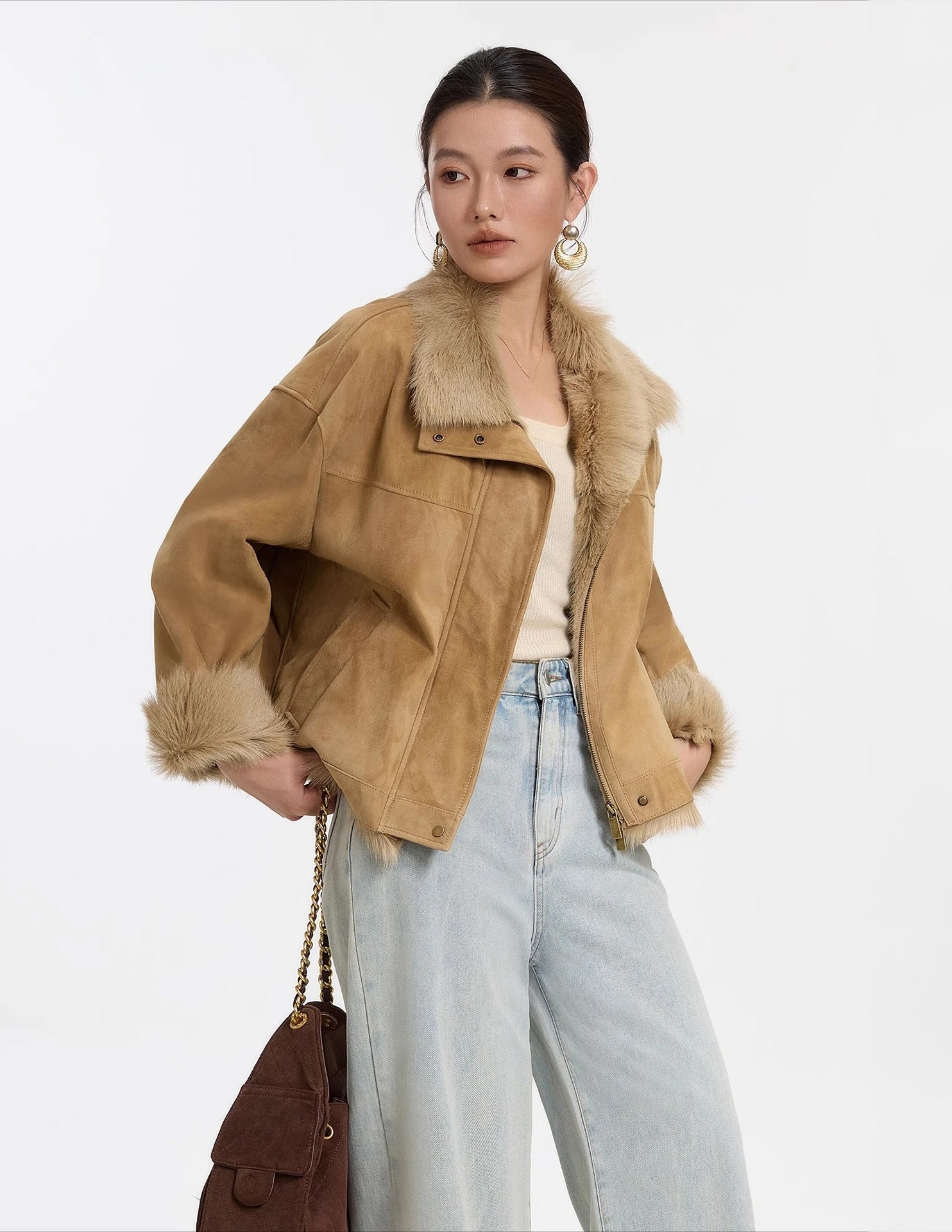 Model in Late Wheat goatskin jacket, standing with hands on hips — From Borcelleclothes.