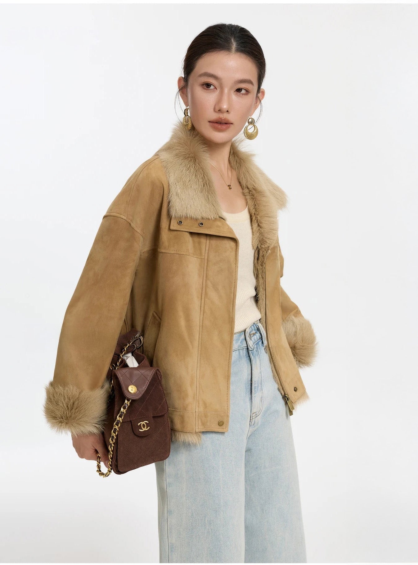 Model wearing a Goatskin jacket in Late Wheat, turned slightly to the side — From Borcelleclothes.
