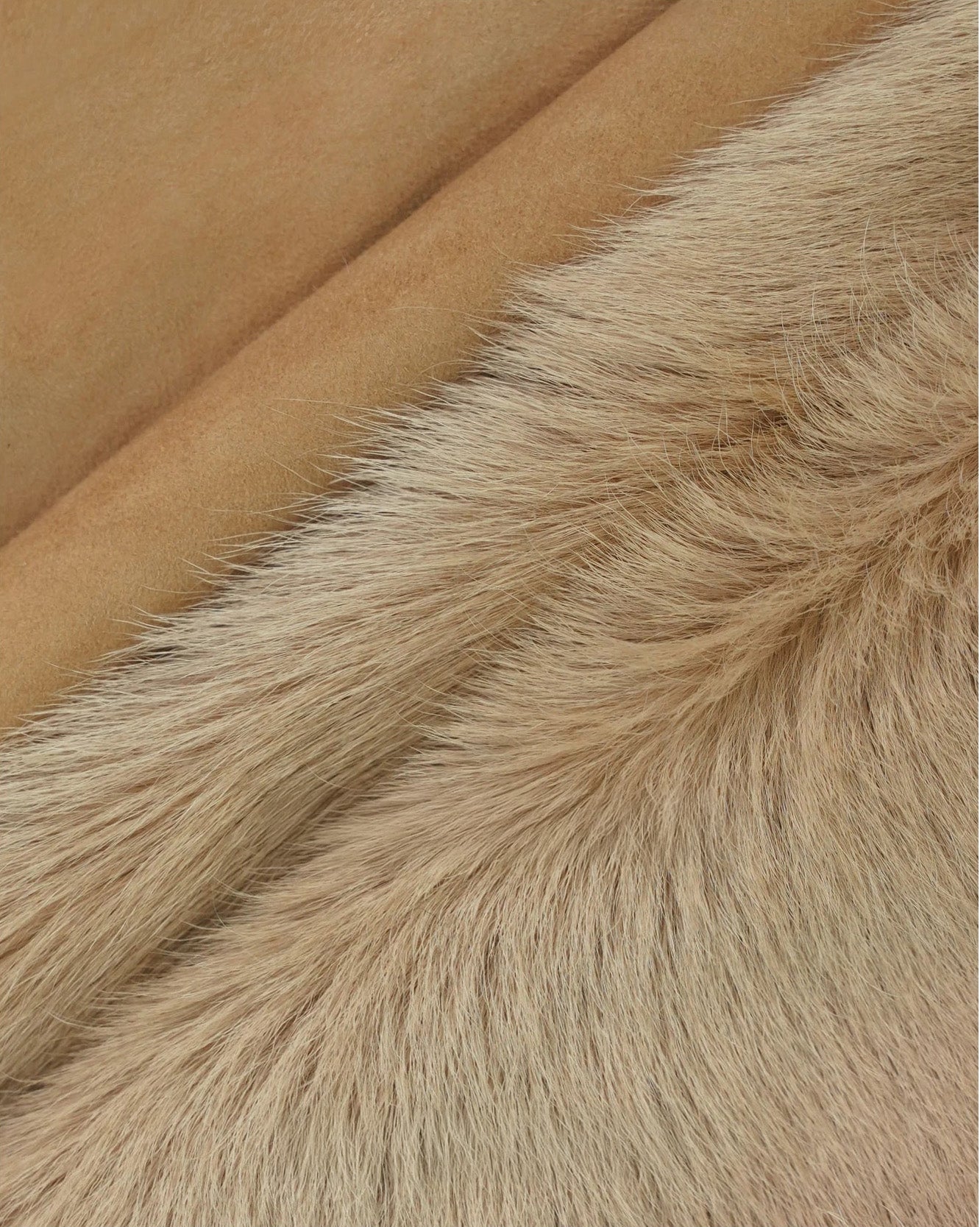 Close-up of suede texture and exposed wool trim on goatskin jacket in Late Wheat — From Borcelleclothes.