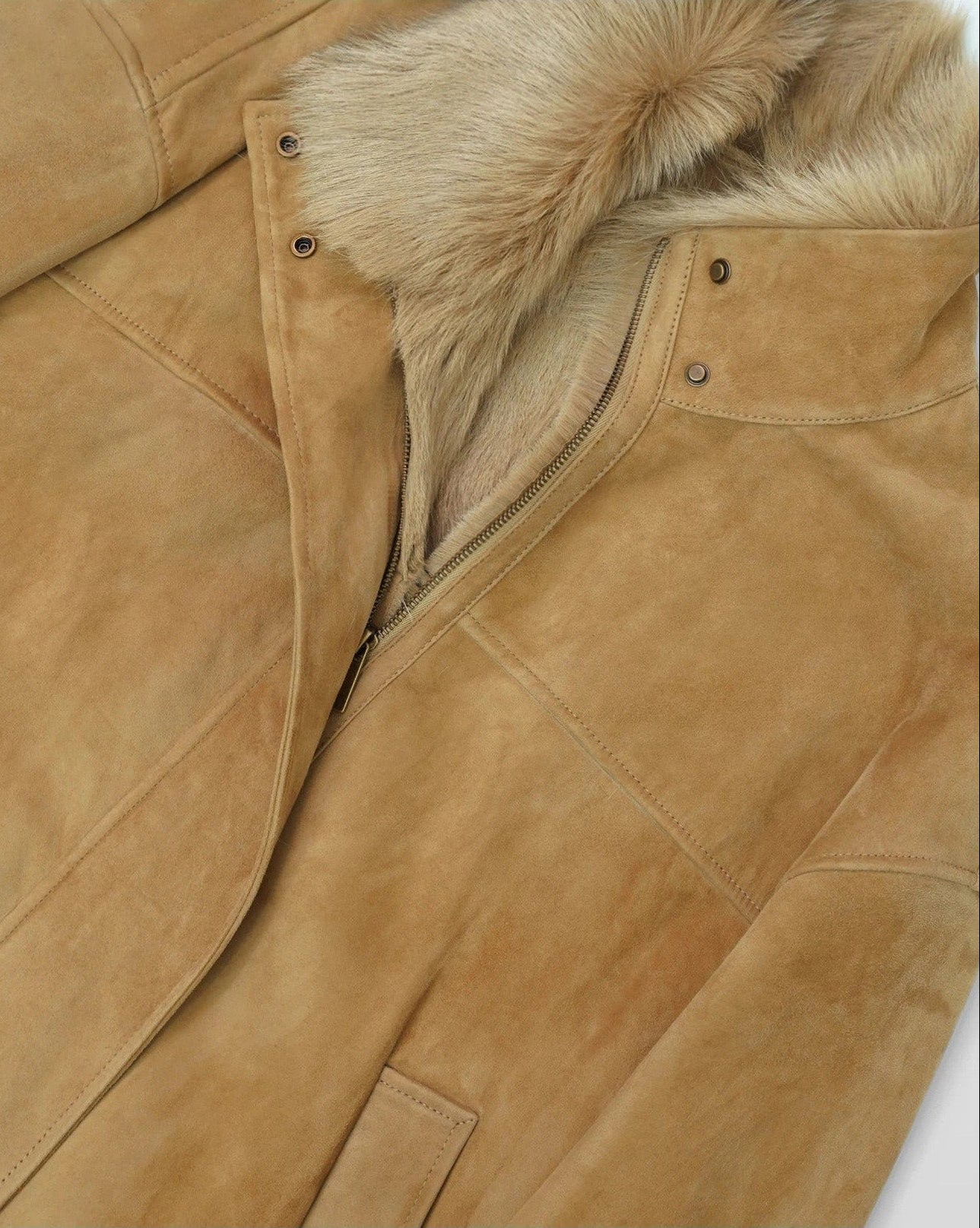 Detail of unfastened collar and soft wool trim on goatskin jacket in Late Wheat — From Borcelleclothes.