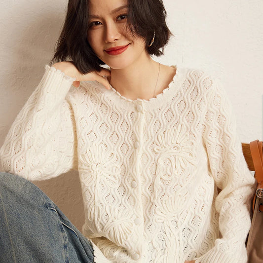 Women's Embossed Lace Cashmere Cardigan in Pearl Bush, crafted from Alashan Cashmere. Featuring an airy embossed lace design, crochet cord floral appliques, and decorative scalloped edges at the neckline, cuffs, and hem for a refined and romantic look, Borcelleclothes.