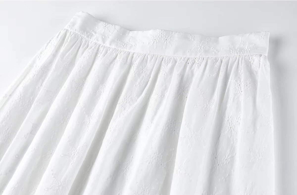 Close-up of the upper front portion of the skirt, showcasing the smooth flat waistband design and neat gathers — From Borcelleclothes.