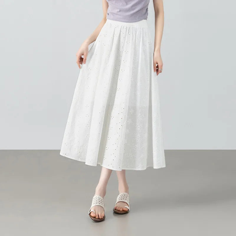 Women's midi-length gathered cotton skirt in Perforated Anticipation shade, featuring intricate Madeira floral eyelet embroidery and a back elasticated waistband. — From Borcelleclothes.