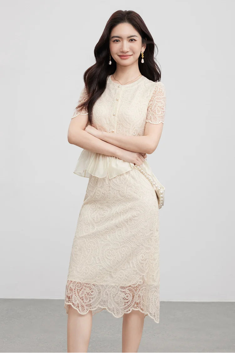 Highlighting the waistline where the embroidered vest transitions into the ethereal sheer peplum. — From Borcelleclothes.