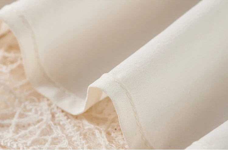 The smooth polyester lining of the skirt, ensuring a flawless drape and comfort against the skin. — From Borcelleclothes.