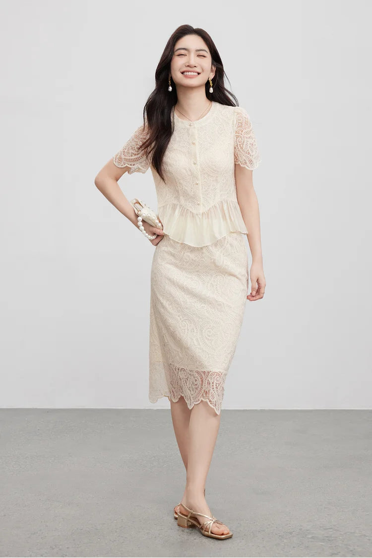 A confident woman with her hand on her hip, showcasing the elegant structure of the zigzag vest hem. — From Borcelleclothes.