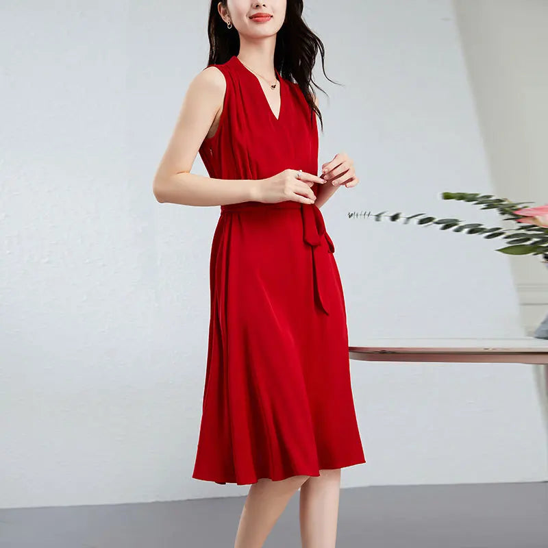 Women's sleeveless flared midi dress in Monte Carlo color, crafted from 19-momme Mulberry silk double georgette, featuring a fixed wrap bodice, sculptural draping at the waist, and a continuous-cut collar. — From Borcelleclothes.