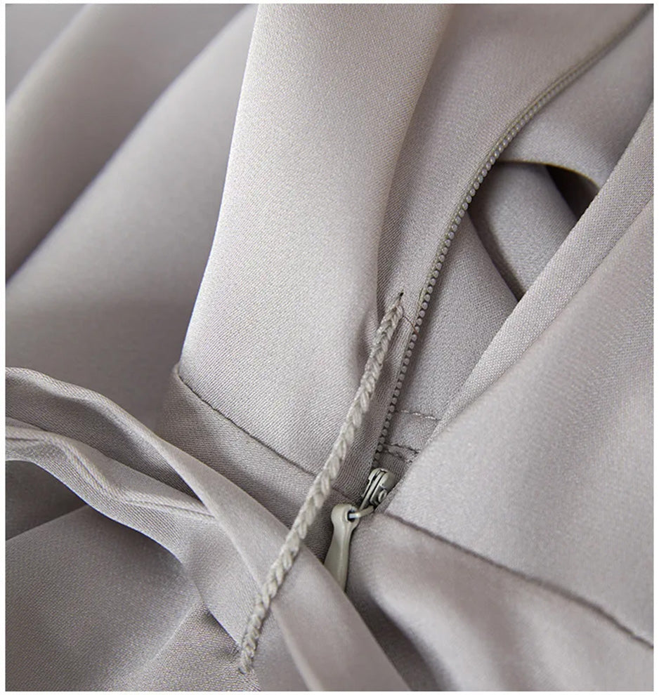 Discreet detail of the invisible side zipper, ensuring a smooth and uninterrupted silhouette — From Borcelleclothes.