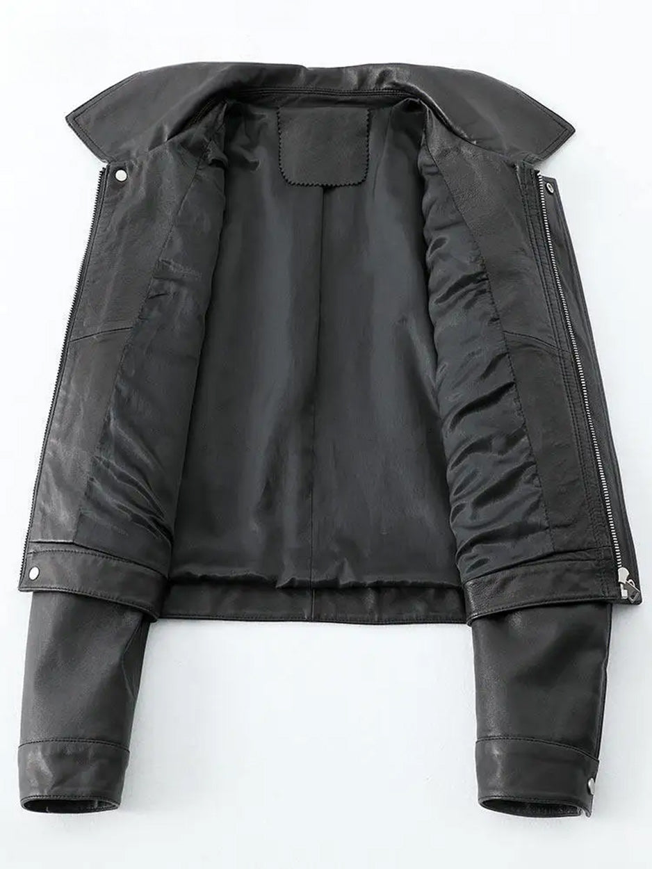 Flat lay view of open cropped sheepskin jacket showing the interior lining in Faded to Black — From Borcelleclothes.